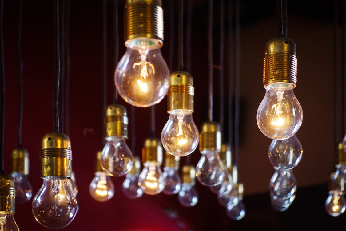 several light bulbs hanging from ceiling